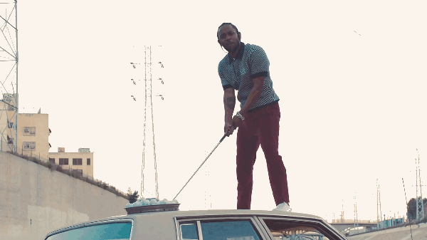 Kendrick playing golf on top of a car